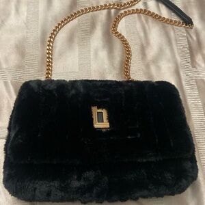 Gorgeous black fur tote or shoulder bag and dust bag.Carried a few times.